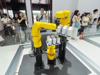 Visitors are visiting a ''six-axis industrial robot'' at the 26th China Beijing International Science and Technology Industry Expo in Beijin...