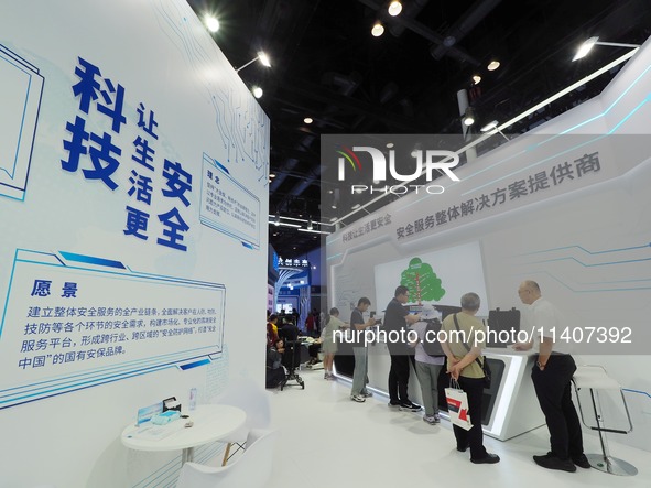 Visitors are viewing security technology products at the 26th China Beijing International Science and Technology Expo in Beijing, China, on...