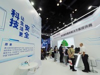 Visitors are viewing security technology products at the 26th China Beijing International Science and Technology Expo in Beijing, China, on...