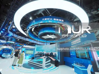 Visitors are visiting the booth of China Southern Power Grid at the 26th China Beijing International Science and Technology Industry Expo in...