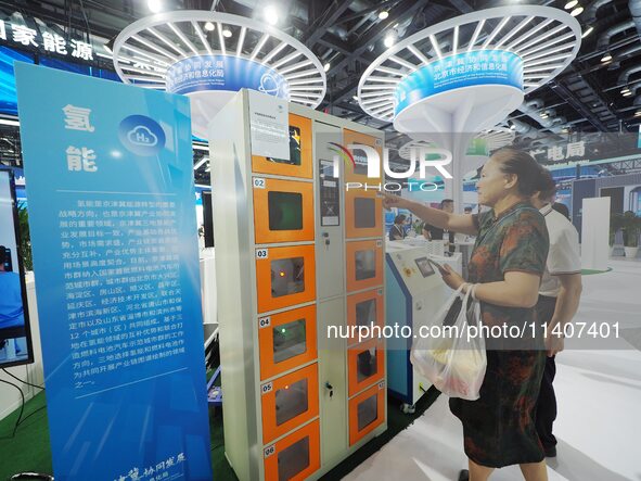 Visitors are visiting a ''smart hydrogen filling tank'' at the 26th China Beijing International Science and Technology Industry Expo in Beij...