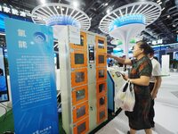 Visitors are visiting a ''smart hydrogen filling tank'' at the 26th China Beijing International Science and Technology Industry Expo in Beij...