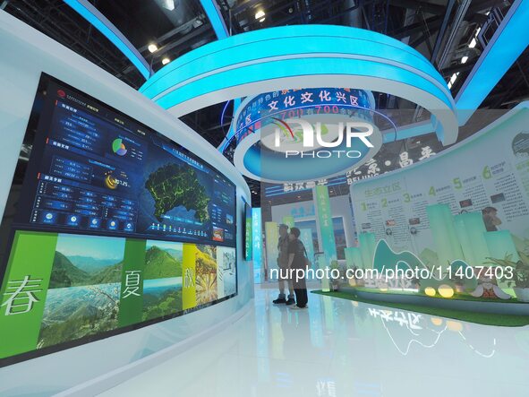 Visitors are visiting the 26th China Beijing International Science and Technology Industry Expo in Beijing, China, on July 14, 2024. 