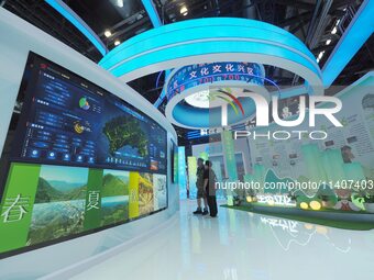 Visitors are visiting the 26th China Beijing International Science and Technology Industry Expo in Beijing, China, on July 14, 2024. (