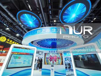 Visitors are visiting the 26th China Beijing International Science and Technology Industry Expo in Beijing, China, on July 14, 2024. (