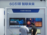 Visitors are visiting the ''Trusted Digital Infrastructure'' at the booth of Beijing University of Posts and Telecommunications at the 26th...