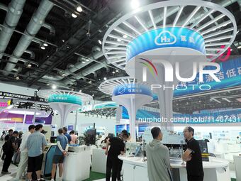 Visitors are visiting hydrogen technology at the 26th China Beijing International Science and Technology Expo in Beijing, China, on July 14,...