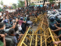 Students are trying to get past police barricades during a march towards the President's house 'Bangabhaban' to submit their memorandum dema...