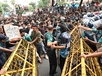 Students are trying to get past police barricades during a march towards the President's house 'Bangabhaban' to submit their memorandum dema...