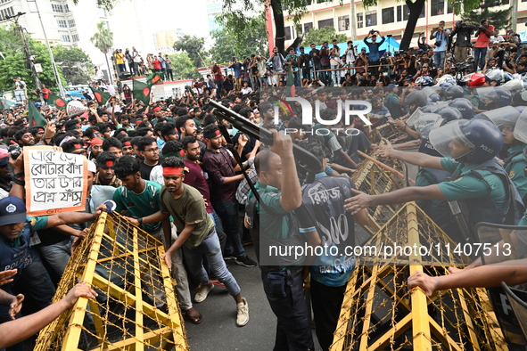 Students are trying to get past police barricades during a march towards the President's house 'Bangabhaban' to submit their memorandum dema...