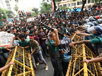 Students are trying to get past police barricades during a march towards the President's house 'Bangabhaban' to submit their memorandum dema...