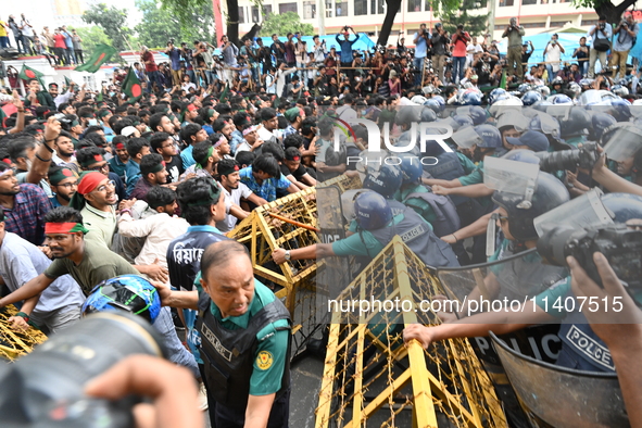 Students are trying to get past police barricades during a march towards the President's house 'Bangabhaban' to submit their memorandum dema...