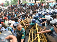 Students are trying to get past police barricades during a march towards the President's house 'Bangabhaban' to submit their memorandum dema...