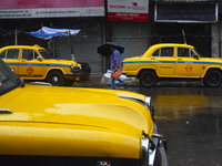 A person is holding an umbrella while walking on the street during the monsoon in Kolkata, India, on July 14, 2024. (