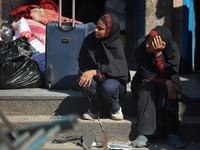 People are checking the destruction at a UN-run school after Israeli bombardment in Nuseirat, in the central Gaza Strip, on July 14, 2024, a...