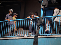 People are checking the destruction at a UN-run school after Israeli bombardment in Nuseirat, in the central Gaza Strip, on July 14, 2024, a...