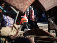 People are checking the destruction at a UN-run school after Israeli bombardment in Nuseirat, in the central Gaza Strip, on July 14, 2024, a...