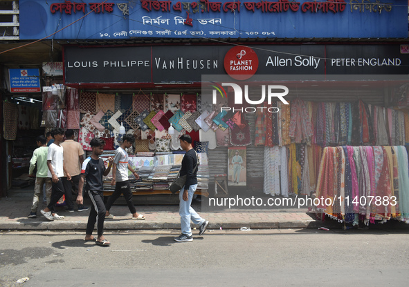 People are selling garments on the roadside in Kolkata, India, on July 14, 2024. 