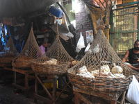 People are selling chicken inside a market in Kolkata, India, on July 14, 2024. (