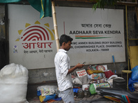 A person is passing next to Aadhar Seva Kendra in Kolkata, India, on July 14, 2024. (