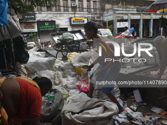 People are working in a plastic recycling hub in Kolkata, India, on July 14, 2024. (