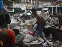 People are working in a plastic recycling hub in Kolkata, India, on July 14, 2024. (