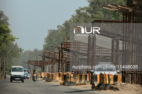 Construction is taking place for a new flyover for a highway extension in Najibabad, Uttar Pradesh, India, on April 19, 2024. 