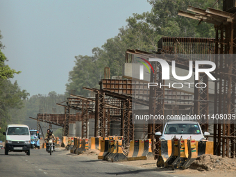 Construction is taking place for a new flyover for a highway extension in Najibabad, Uttar Pradesh, India, on April 19, 2024. (