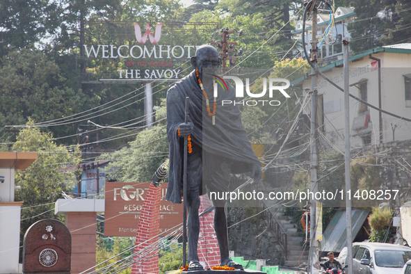 The statue of Mahatma Gandhi is standing along Mall Road in Mussoorie, Uttarakhand, India, on April 18, 2024. 