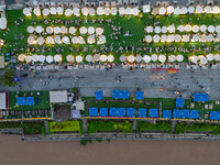 People are eating food at the night market on Nanbin Road in Chongqing, China, on July 14, 2024. It is reported that with the arrival of the...