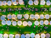 People are eating food at the night market on Nanbin Road in Chongqing, China, on July 14, 2024. It is reported that with the arrival of the...