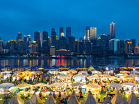 People are eating food at the night market on Nanbin Road in Chongqing, China, on July 14, 2024. It is reported that with the arrival of the...