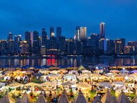 People are eating food at the night market on Nanbin Road in Chongqing, China, on July 14, 2024. It is reported that with the arrival of the...