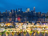 People are eating food at the night market on Nanbin Road in Chongqing, China, on July 14, 2024. It is reported that with the arrival of the...