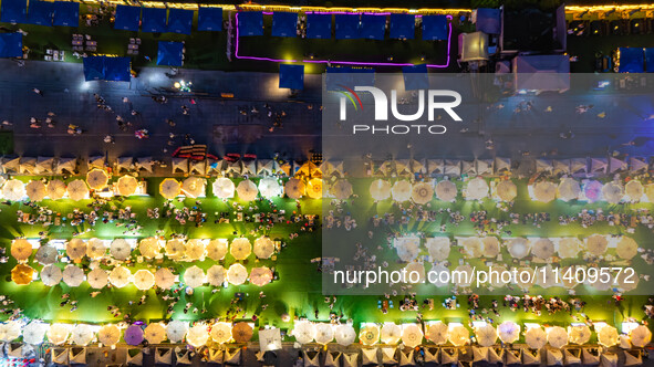 People are eating food at the night market on Nanbin Road in Chongqing, China, on July 14, 2024. It is reported that with the arrival of the...