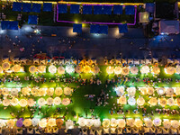 People are eating food at the night market on Nanbin Road in Chongqing, China, on July 14, 2024. It is reported that with the arrival of the...