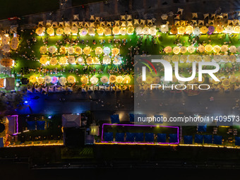 People are eating food at the night market on Nanbin Road in Chongqing, China, on July 14, 2024. It is reported that with the arrival of the...