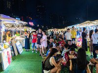 People are eating food at the night market on Nanbin Road in Chongqing, China, on July 14, 2024. It is reported that with the arrival of the...