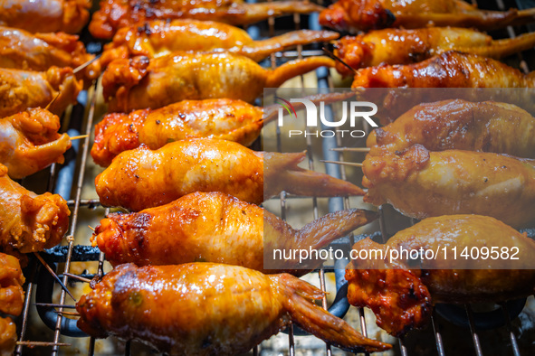 People are eating food at the night market on Nanbin Road in Chongqing, China, on July 14, 2024. It is reported that with the arrival of the...