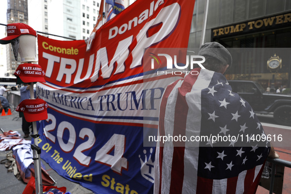 Supporters  of former President Donald Trump’s gather with flags in front of his Fifth Avenue residence on July 14,2024 in New York City, US...