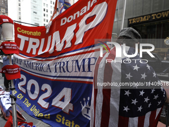 Supporters  of former President Donald Trump’s gather with flags in front of his Fifth Avenue residence on July 14,2024 in New York City, US...