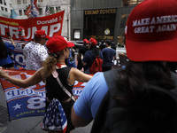 Supporters  of former President Donald Trump’s gather with flags in front of his Fifth Avenue residence on July 14,2024 in New York City, US...