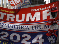 Supporters  of former President Donald Trump’s gather with flags in front of his Fifth Avenue residence on July 14,2024 in New York City, US...