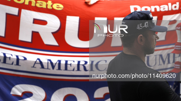 Supporters  of former President Donald Trump’s gather with flags in front of his Fifth Avenue residence on July 14,2024 in New York City, US...