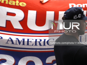 Supporters  of former President Donald Trump’s gather with flags in front of his Fifth Avenue residence on July 14,2024 in New York City, US...