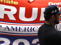 Supporters  of former President Donald Trump’s gather with flags in front of his Fifth Avenue residence on July 14,2024 in New York City, US...