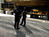 Police stand watch as supporters  of former President Donald Trump’s gather with flags in front of his Fifth Avenue residence on July 14,202...