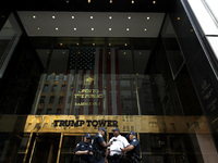 Police stand watch as supporters  of former President Donald Trump’s gather with flags in front of his Fifth Avenue residence on July 14,202...