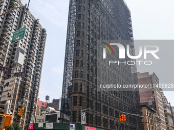 Flatiron Building covered in scaffolding in Manhattan, New York City, United States of America on July 5th, 2024. (