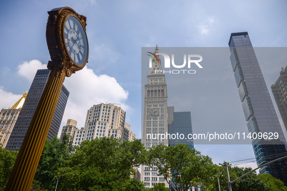 Fifth Avenue Building Gold Clock in Flatiron district in New York City, United States of America on July 5th, 2024. 